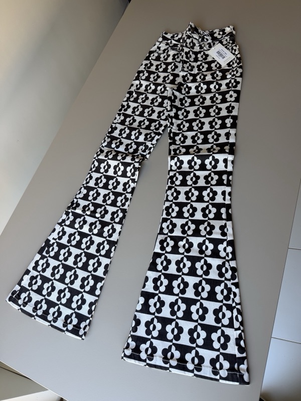 Ghanda daisy-print flared jeans, new with tags, listed on Frippy